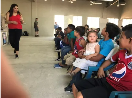 Nellet teaching a group of children